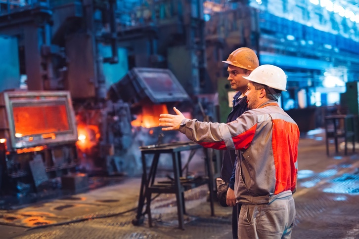 workers near fire with asbestos